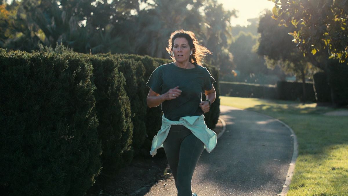 A woman out for a morning walk in the park